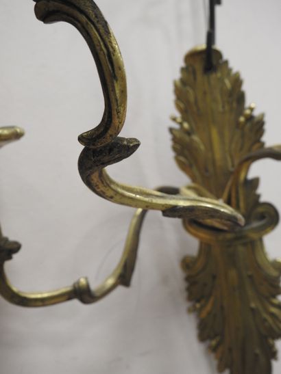 null Pair of chased and gilded bronze sconces with three arms of lights in the form...