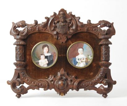 Carved wooden frame with heraldic decoration...