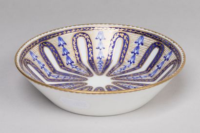 null SEVRES : Porcelain saucer with polychrome and gold radiating decoration. Mark...