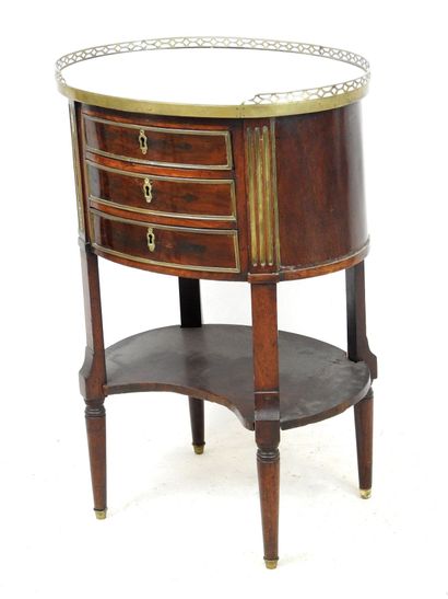 null TABLE DE SALON dite Tambour in dark mahogany with brass, opening with three...