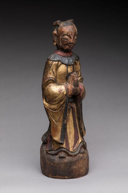 null CHINA: Statuette of a monk praying with joined hands in carved wood, gilded...