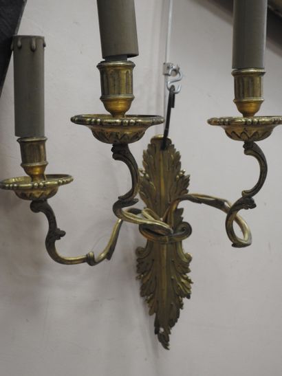 null Pair of chased and gilded bronze sconces with three arms of lights in the form...