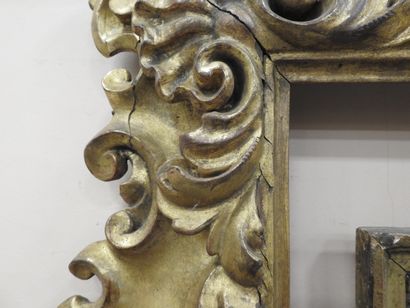 null Bare frame in molded and gilded wood with rich decoration of shells and attributes...