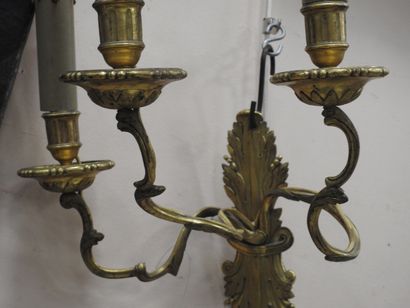 null Pair of chased and gilded bronze sconces with three arms of lights in the form...
