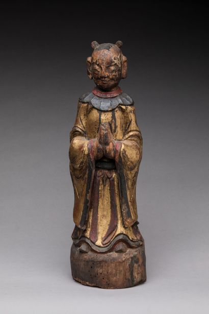 null CHINA: Statuette of a monk praying with joined hands in carved wood, gilded...