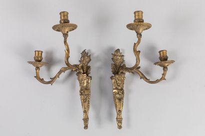 null Pair of gilt bronze sconces with two off-center light arms with faces, rich...