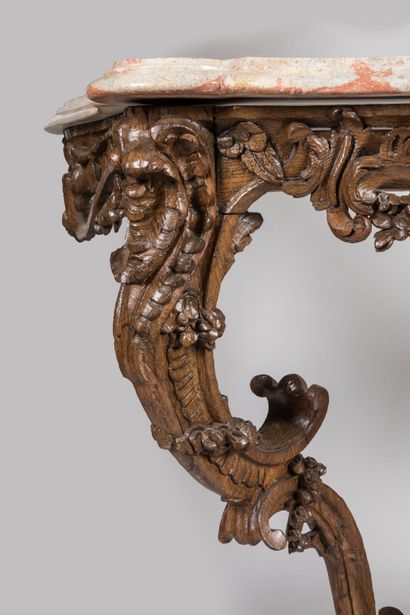 null CONSOLE in molded and carved oak; the belt is centered with a rocaille cartouche...