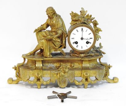 null Gilded clock decorated with a subject representing Molière seated, decorated...