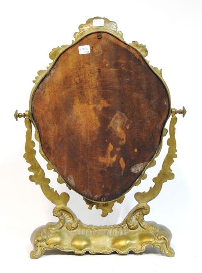null Mirror of toilet in bronze of rocaille style with decoration of putti and interlaces.
H....