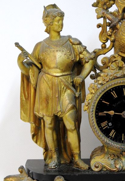 null Clock of style troubadour in regule with gilded patina with decoration of two...