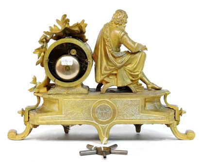 null Gilded clock decorated with a subject representing Molière seated, decorated...