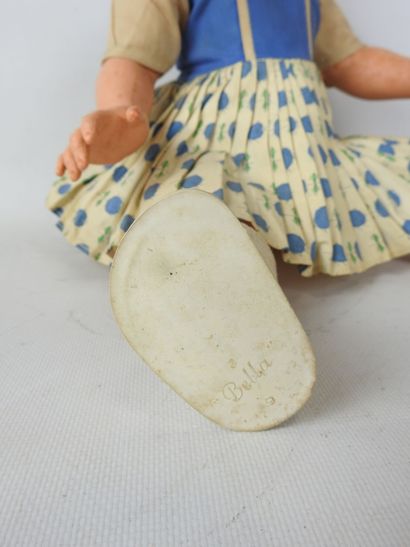 null BELLA plastic doll. Blue sleeping eyes and noisemaker. Signed under the shoes....