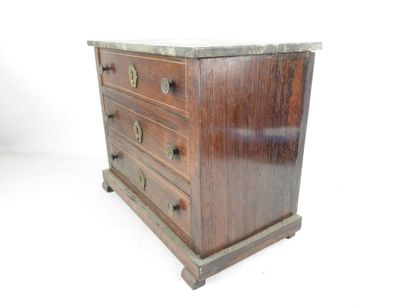null MAITRISE COMMODE in rosewood opening with three drawers, topped with a Sainte-Anne...