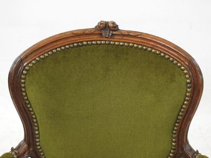 null Cabriolet armchair in molded and carved beech, green velvet upholstery.
Louis...