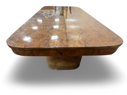 null Elm burl veneered DINING TABLE, the rounded top surmounted by a glass resting...