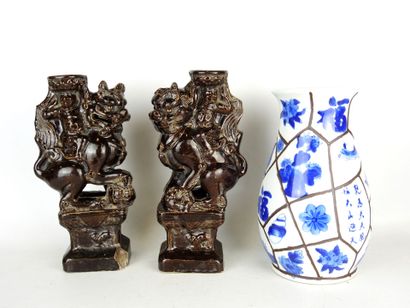 null CHINA: Pair of brown glazed ceramic candleholders decorated with a figure riding...
