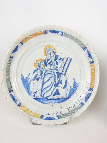 null NEVERS: Pair of blue, yellow and green polychrome earthenware plates decorated...