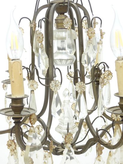 null Iron chandelier with six arms adorned with crystal pendants. Early 20th century....