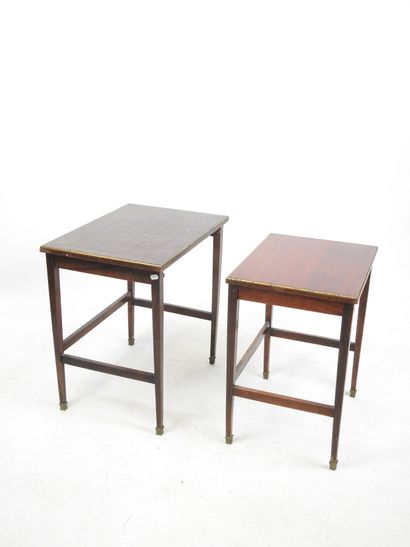 null TWO GIGOGNE TABLES of rectangular form in stained wood resting on sheath legs....