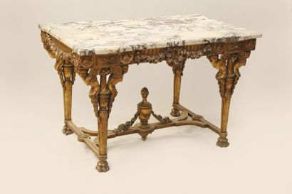  IMPORTANT MIDDLE TABLE IN GILDED WOOD CARVED IN THE LOUIS XVI STYLE. TOP OF MARBLE... Gazette Drouot