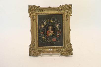 ECOLE FLAMANDE "Vierge à l'Enfant dans une couronne de fleurs", probablement XIXe,...