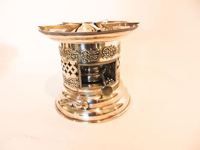 null Stove, XXth, silver plated metal, mark on reverse, h. 20 cm.