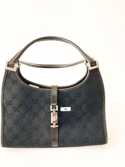 GUCCI Handbag in black monogrammed canvas, with cover, l. 26 cm.