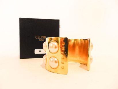 CELINE - PARIS Bracelet cuff in gold plated metal paved with half pearls, marked,...