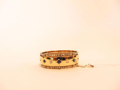 null Open cuff bracelet in 18K yellow gold set with diamonds and sapphires between...