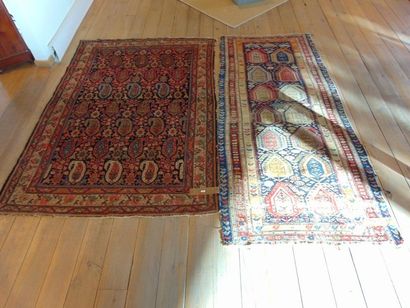 null Two antique Persian carpets with boteh seedlings on night blue field, 202x138...