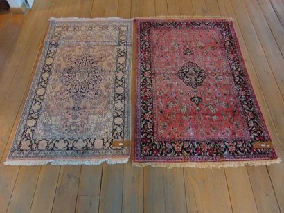 null Two small Persian rugs in the Nain style with central medallion and polychrome...
