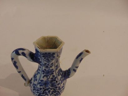 CHINE Small Persian ewer with blue and white floral decoration in light relief, Qing...