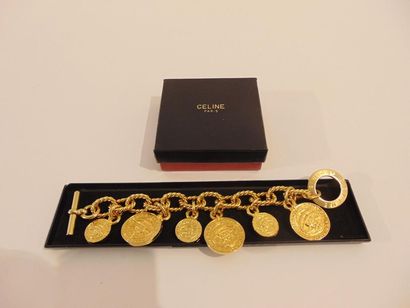 CELINE - PARIS Bracelet à breloques en métal doré, marqué, avec boîte, l. 23 cm.