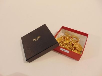 CELINE - PARIS Bracelet à breloques en métal doré, marqué, avec boîte, l. 23 cm.
