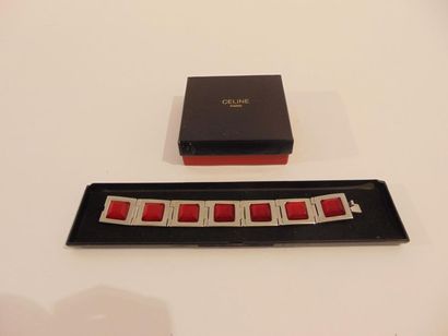 CELINE - PARIS Bracelet articulé en métal argenté serti façon rubis, marqué, avec...