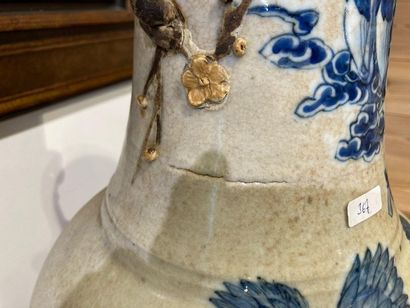 CHINE Large baluster with blue and white decoration in slight relief on a cracked...