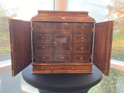 null Elegant Louis XVI period cabinet with a drawer and two doors opening to reveal...