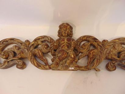 null Decorative pediment with hunting figures centred on a putto on a richly carved...