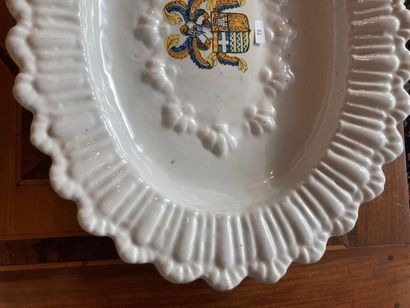 France Polylobed and gadrooned oval dish with polychrome decoration of coats of arms,...