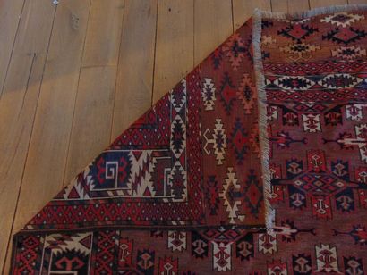null Kazak-style Caucasian carpet with polychrome geometric patterns on a Capuchin...