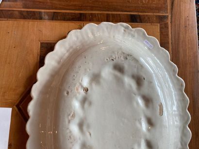 France Polylobed and gadrooned oval dish with polychrome decoration of coats of arms,...