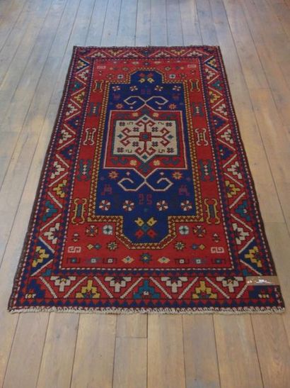 null Koliai style Persian carpet with polychrome geometric patterns on night blue...