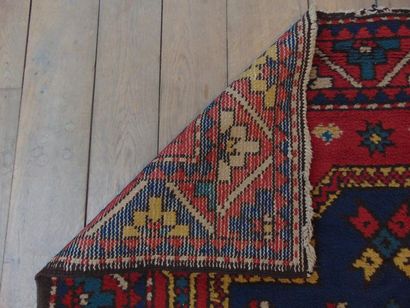 null Koliai style Persian carpet with polychrome geometric patterns on night blue...