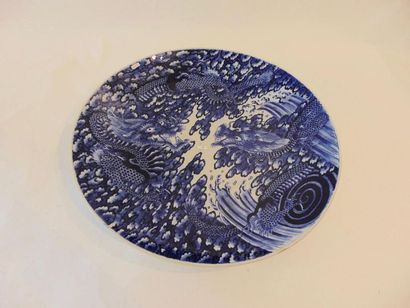null Large deep dish with far eastern blue and white decoration of two dragons facing...