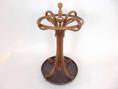 null Umbrella stand, Thonet type, early 20th century, thermoformed wood, h. 72 cm...