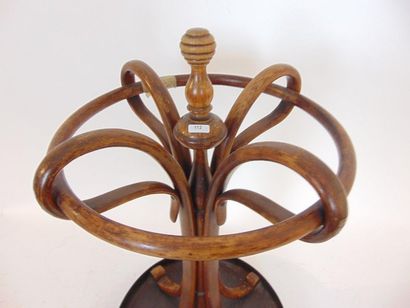 null Umbrella stand, Thonet type, early 20th century, thermoformed wood, h. 72 cm...