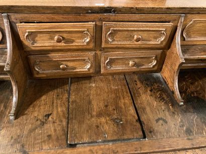 null Scriban opening with three drawers and a flap, early 19th century, moulded oak...
