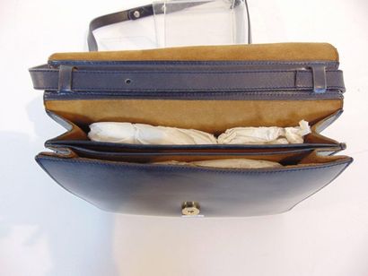 DELVAUX - BRUXELLES Navy leather handbag, with mirror (Christian Dior) and cover,...