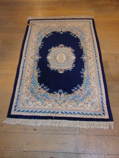 null Two Kerman-style Nepalese rugs with central medallion on indigo field, 196x123...