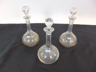 null Pair of carafes, late 19th century, cut glass, h. 31 cm; a matching carafe is...